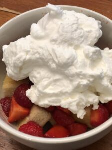 Hot milk cake with strawberries and whipped cream